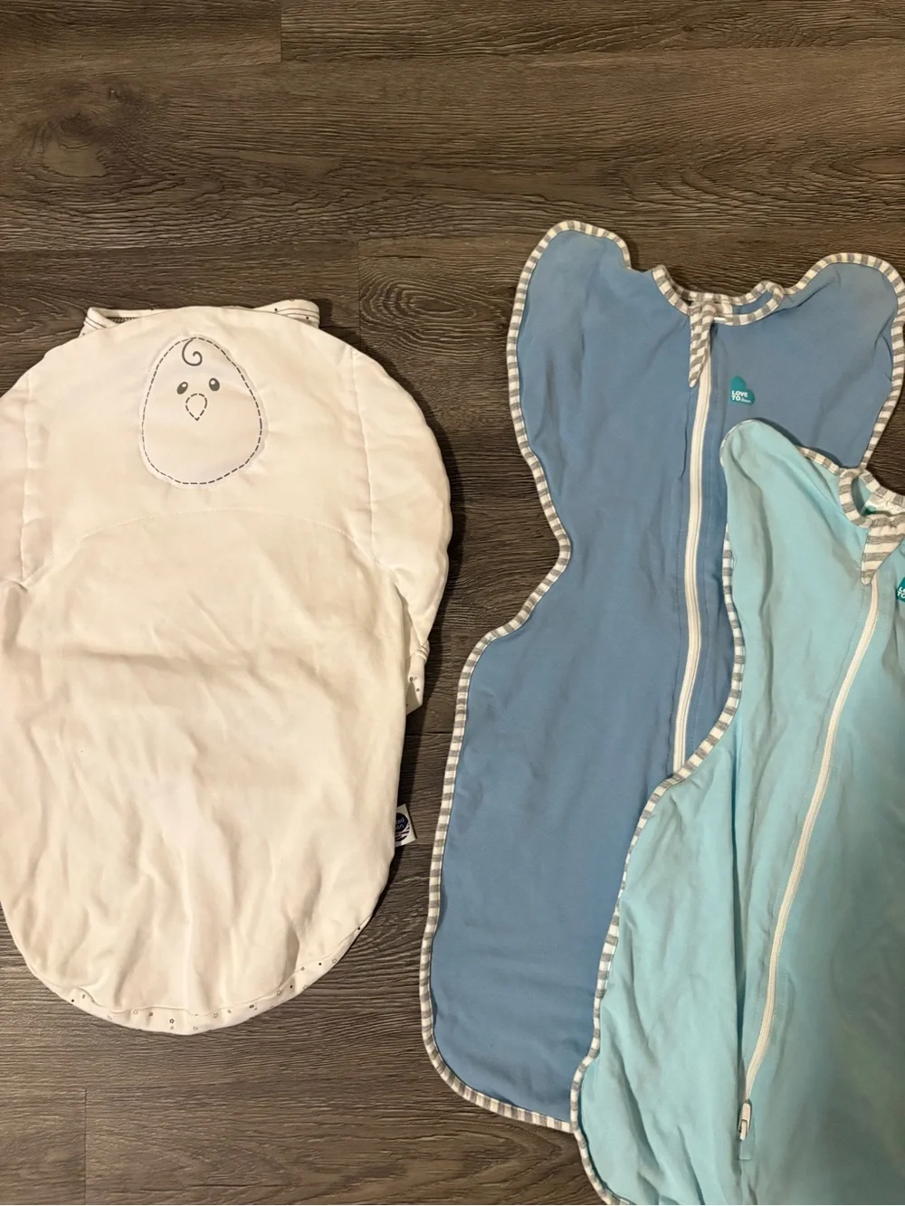 Nested Bean White, Light Blue and Blue Baby Sleep Sacks love to dream arms up